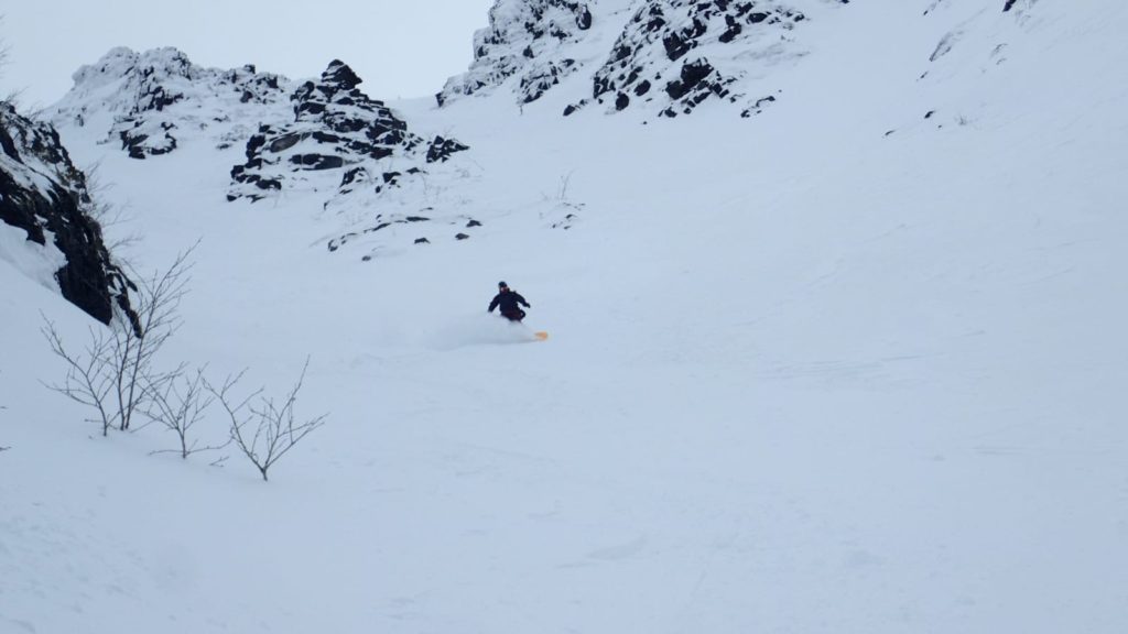 Riding through the spot that connects the two chutes on Mount Juksporr