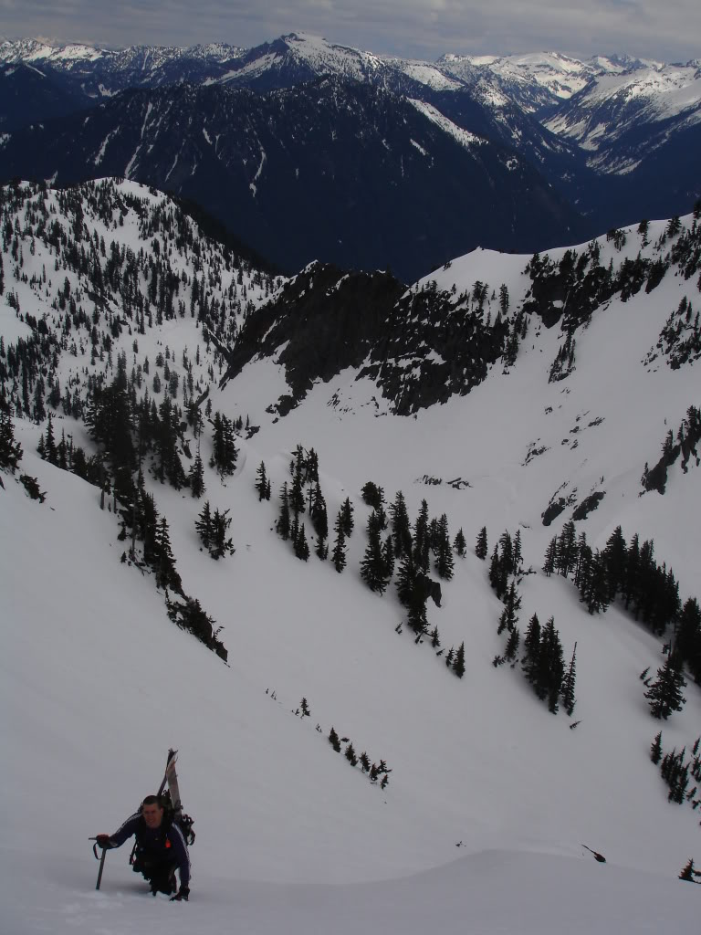 John climbing up with Snow Lake in the valley bellow and Big Snow Mountain in the Distance during the Alpental to Granite ski traverse