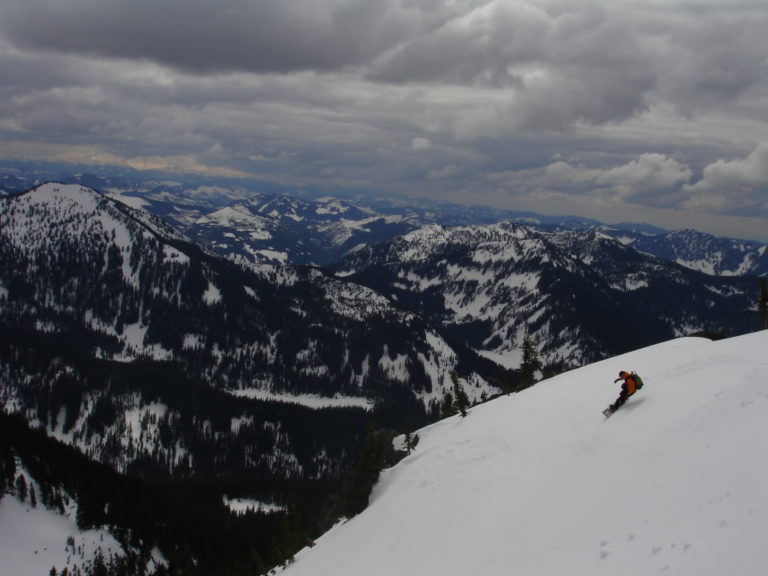Riding the upper slope of Kaleetan Peak with Granite Mountain in the background