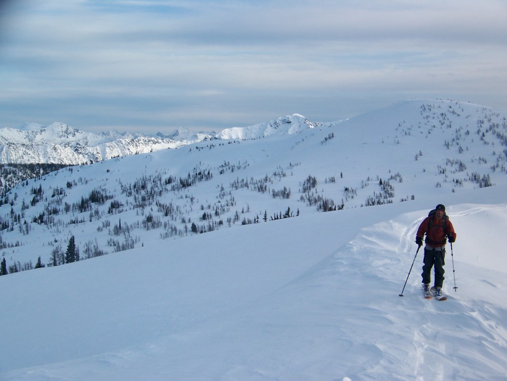 ski touring up to the ridge with the Chiwaukum Mountains in the background