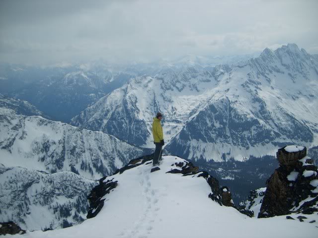 Standing on the summit of Black Peak with Mount Goode in the background