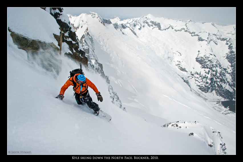 Snowboarding down the North Face of Buckner Mountain wit Eldorado Peak and the Forbidden Traverse in the distance