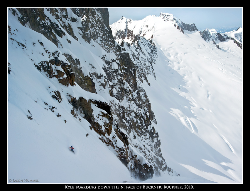 Snowboarding down the North Face of Buckner Mountain with Sahale in the distance 