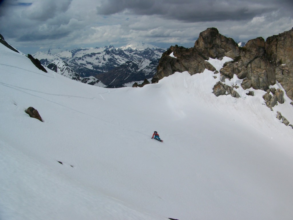 Snowboarding down the East basin of Cardinal Peak