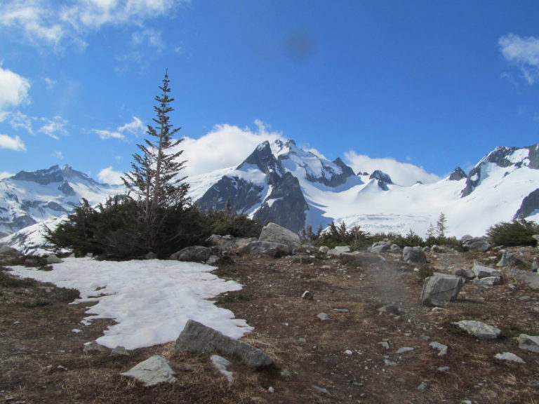 Our camp at White Rocks Lake with Dome Peak in the distance near North Cascades National Park and Cascade Pass on the Ptarmagin Traverse