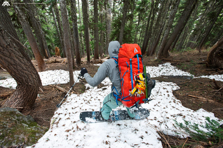 snowboarding down the last bit of snow towards the South Fork of Agnes Creek while on the Extended Ptarmagin Traverse