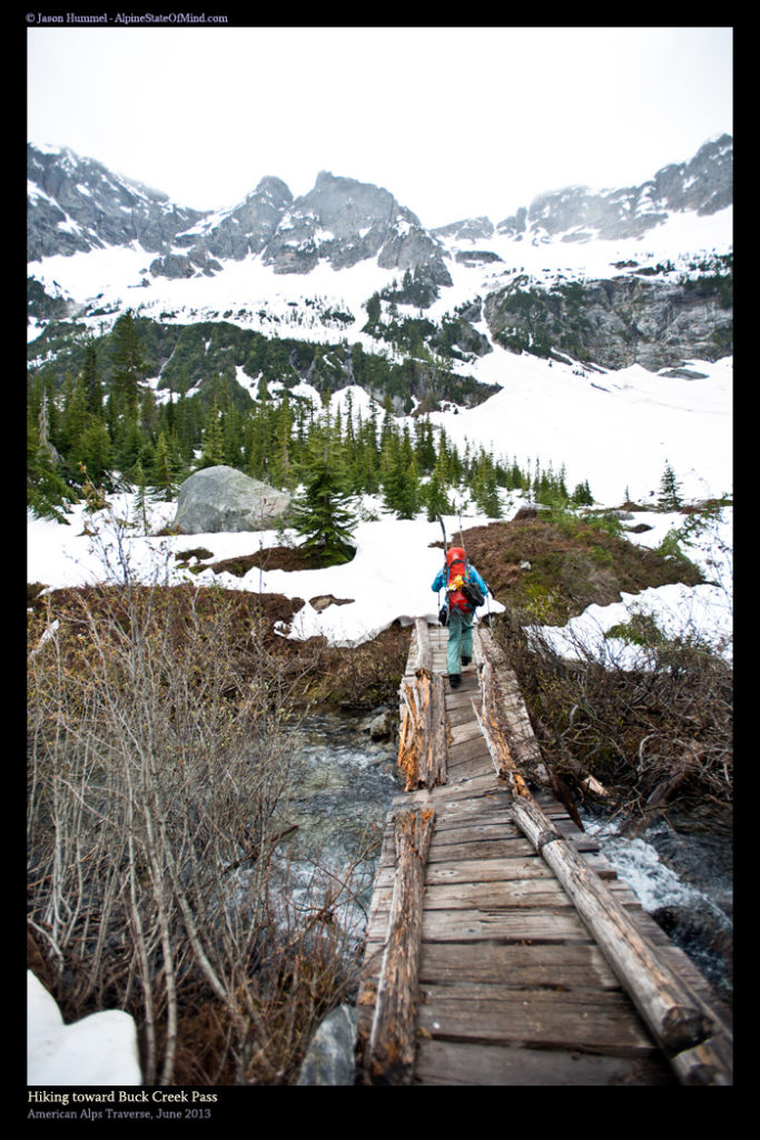 Hiking towards Cloudy Pass as Sitting Bull Mountain is in the distance and following the Pacific Crest Trail while on the Extended Ptarmagin Traverse