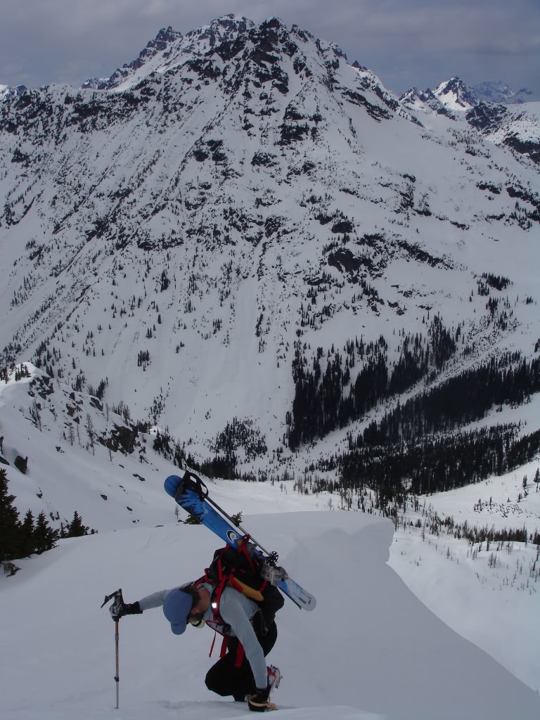 Gaining the summit of Frisco Mountain satellite peak with Corteo Mountain in the background