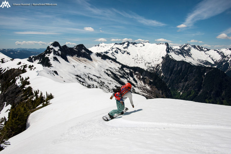 Snowboarding along Isolation Ridge the Isolation Traverse in North Cascades National Park in Washington State