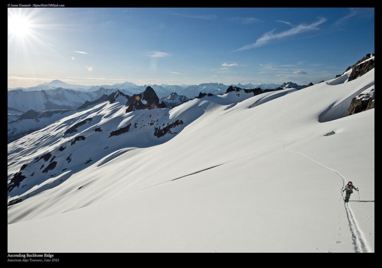 skinning on Backbone Ridge with Mount Baker in the background on the Isolation Traverse in North Cascades National Park in Washington State