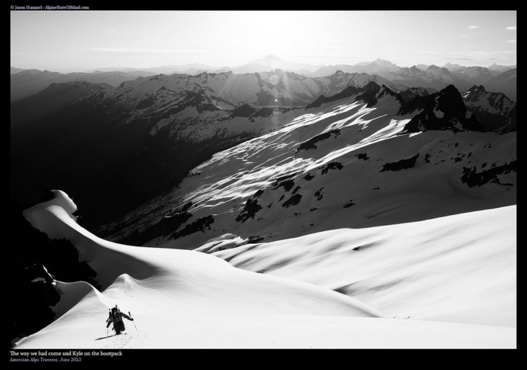 Climbing with Backbone ridge glowing in the distance on the Isolation Traverse in North Cascades National Park in Washington State