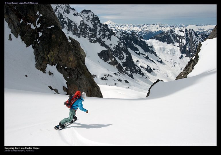 Snowboarding into the Marble Cirque on the Isolation Traverse in North Cascades National Park in Washington State
