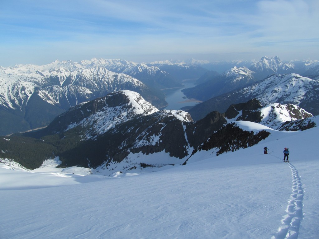 ski touring up the Nohokomeen Glacier on Jack Mountain with Ross Lake in the background