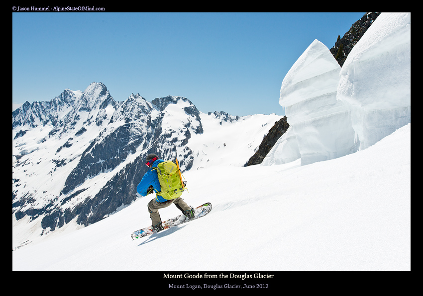 Snowboarding down Mount Logan via the Douglas Glacier with Goode Mountain in the Distance