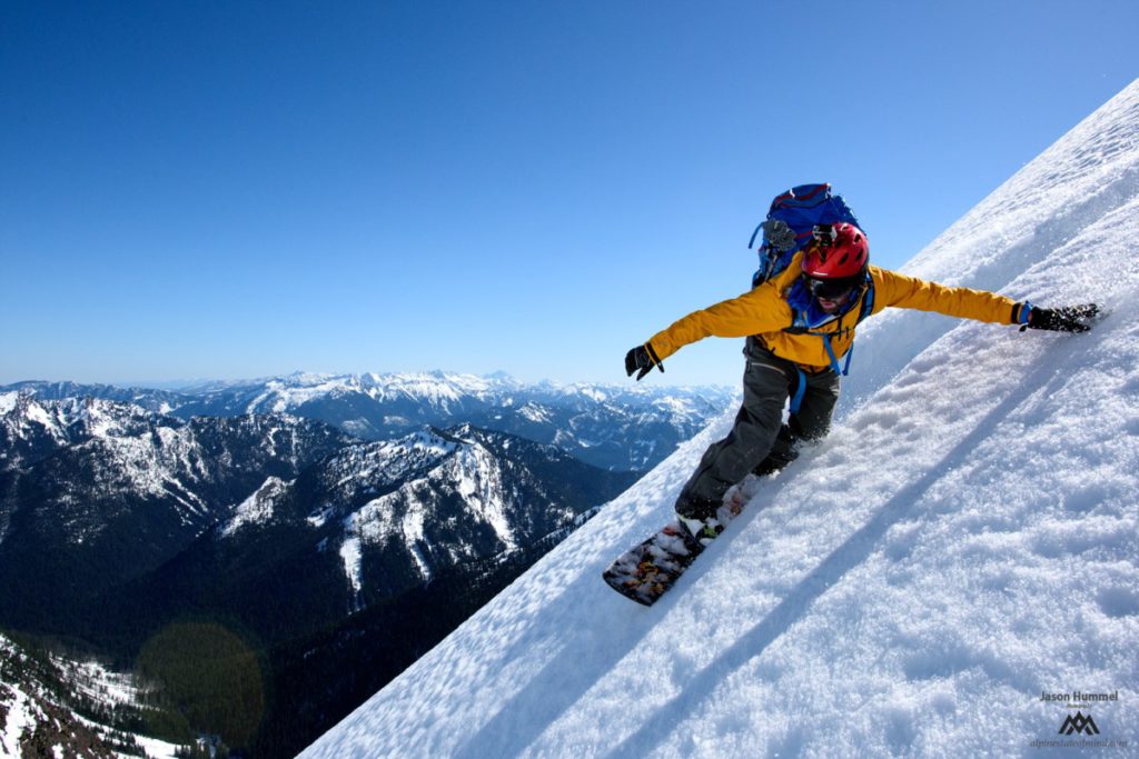 Ben snowboarding into the south face of Whittier Mountain