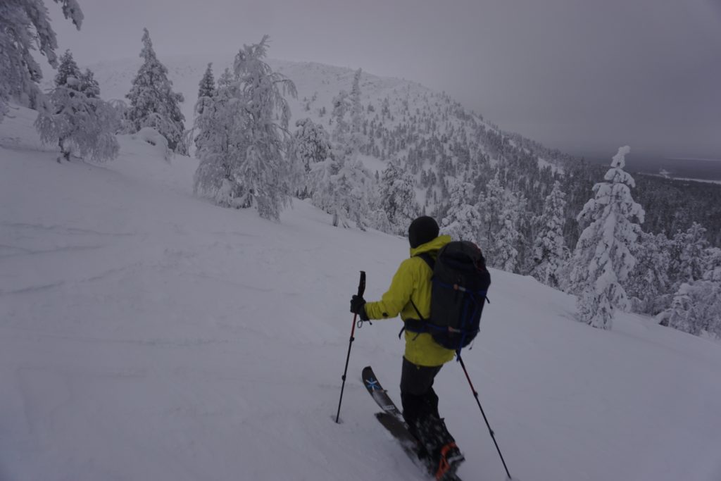 Breaking trail to our first run with Pyhä in the background