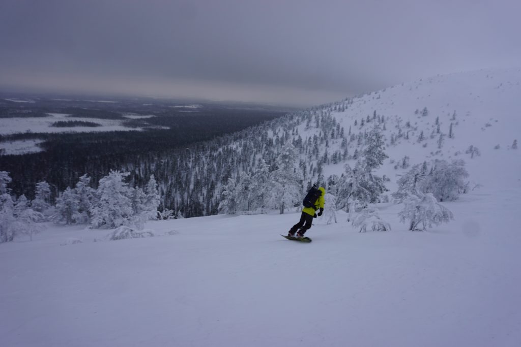 Snowboarding down our first run in the Pyhä Backcountry