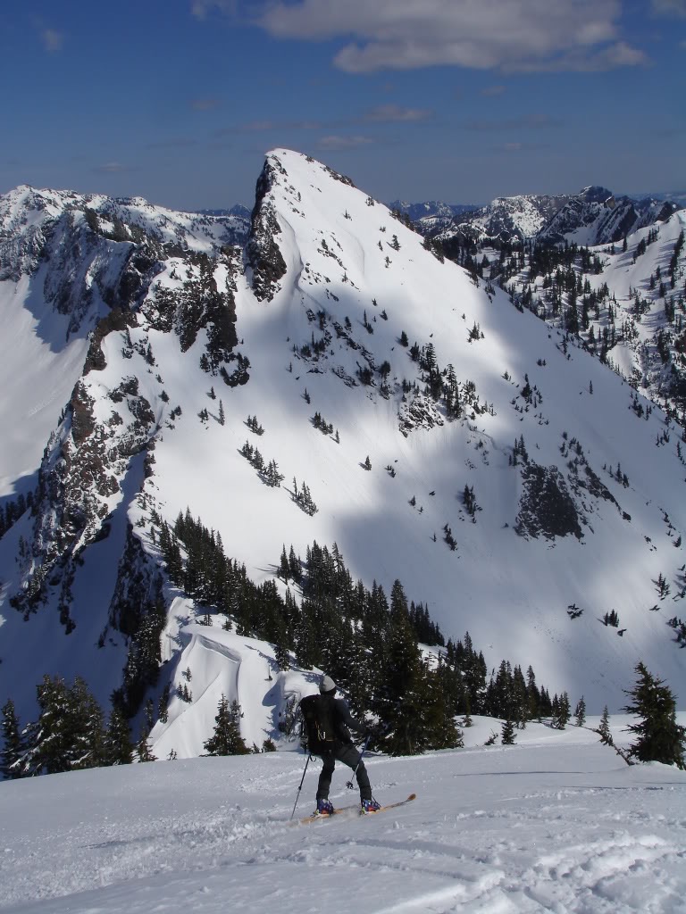 Amar skiing down with Red Peak in the background