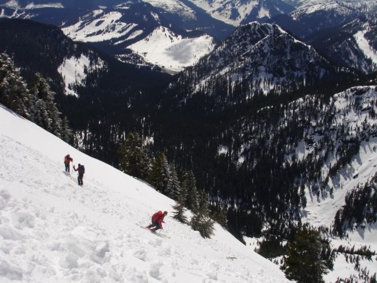 Our crew skiing off Red Peak with Snoqualmie ski resort in the background