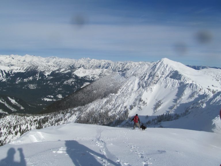 Scott and Kololo riding down Rock Mountain on the Rock, Howard Mastiff Traverse