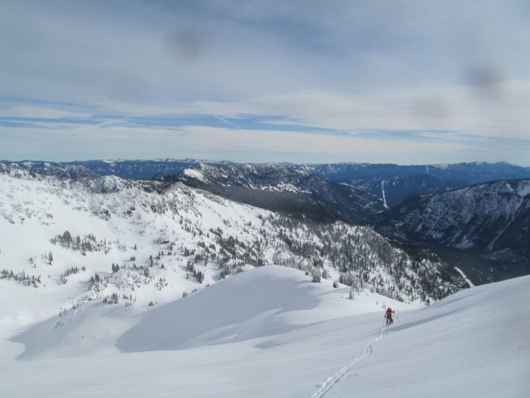 Scott ski touring up to the summit of Rock Mountain on the Rock, Howard Mastiff Traverse