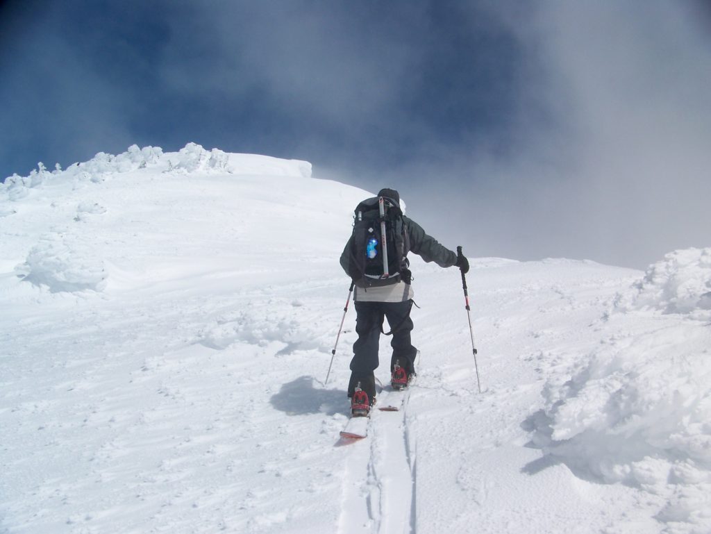 ski touring to the summit in a sucker hole