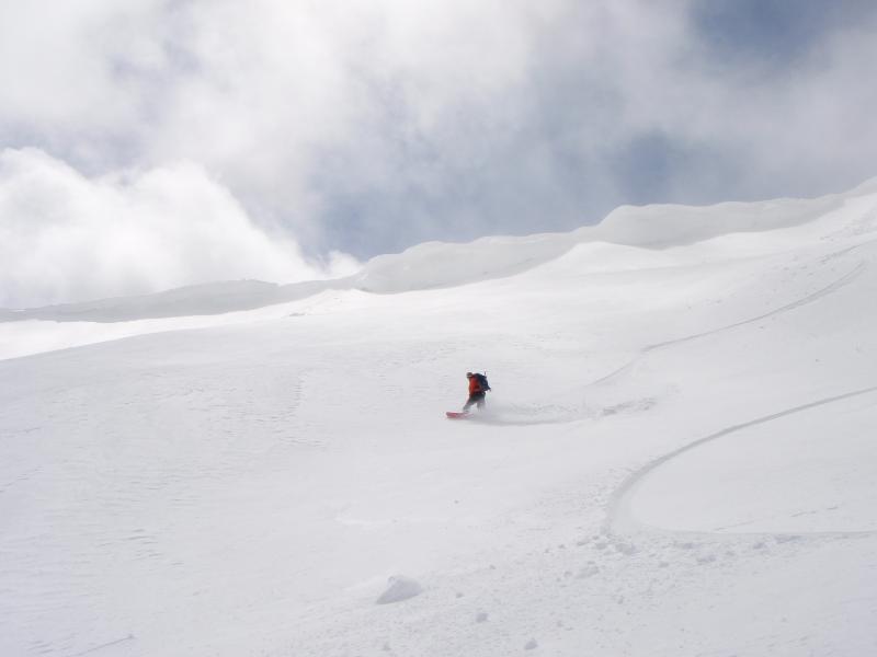 snowboarding down the upper portion of Rock Mountain near Stevens Pass