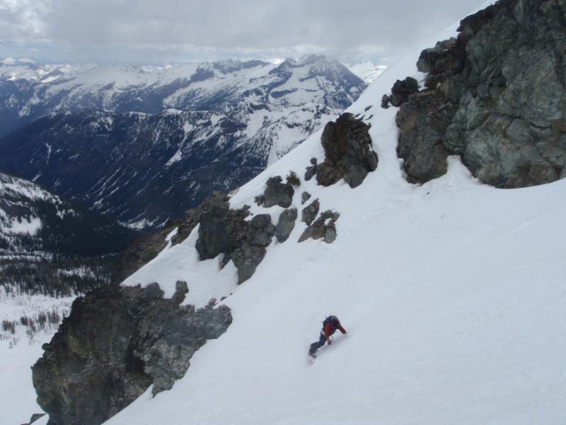 Scott making a great snowboard turn into Leroy Basin on Seven Fingered Jack