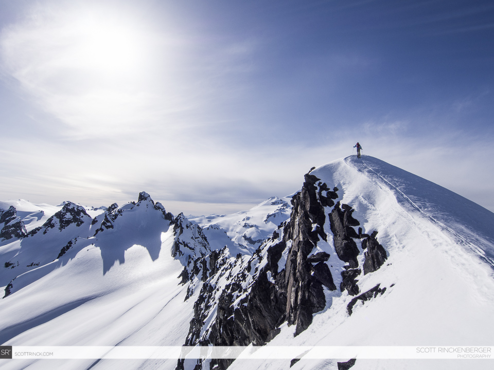 Making it to a sub summit of Tenpeak Mountain with Glacier Peak in the background