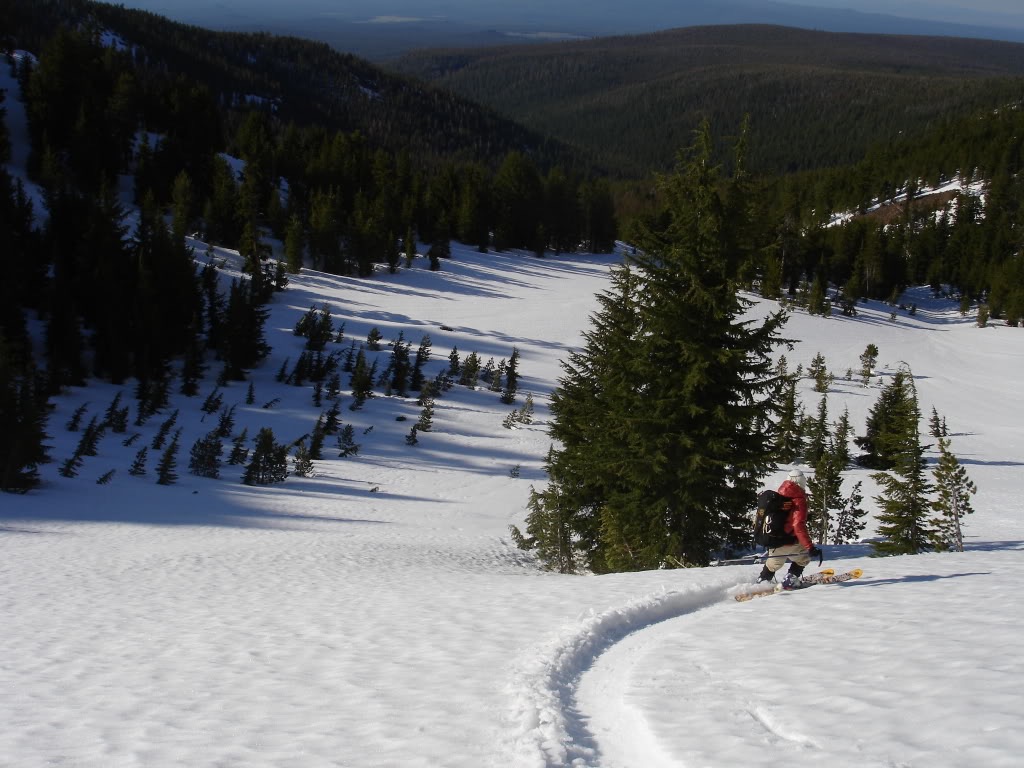 Amar skiing down to the lower elevated bowl