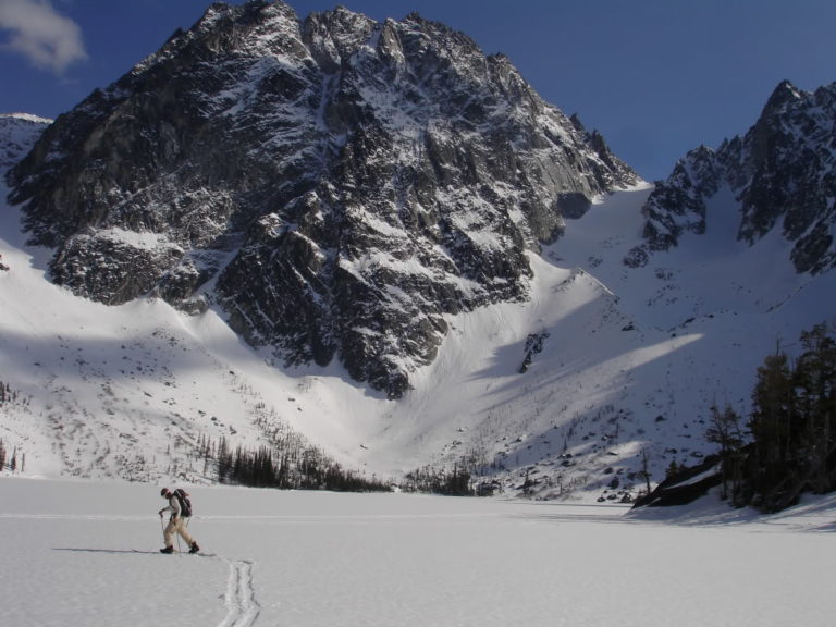 skinning across the lake with our line in the background