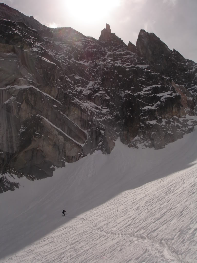 Jeff breaking trail with the Summit of Dragon Tail above him