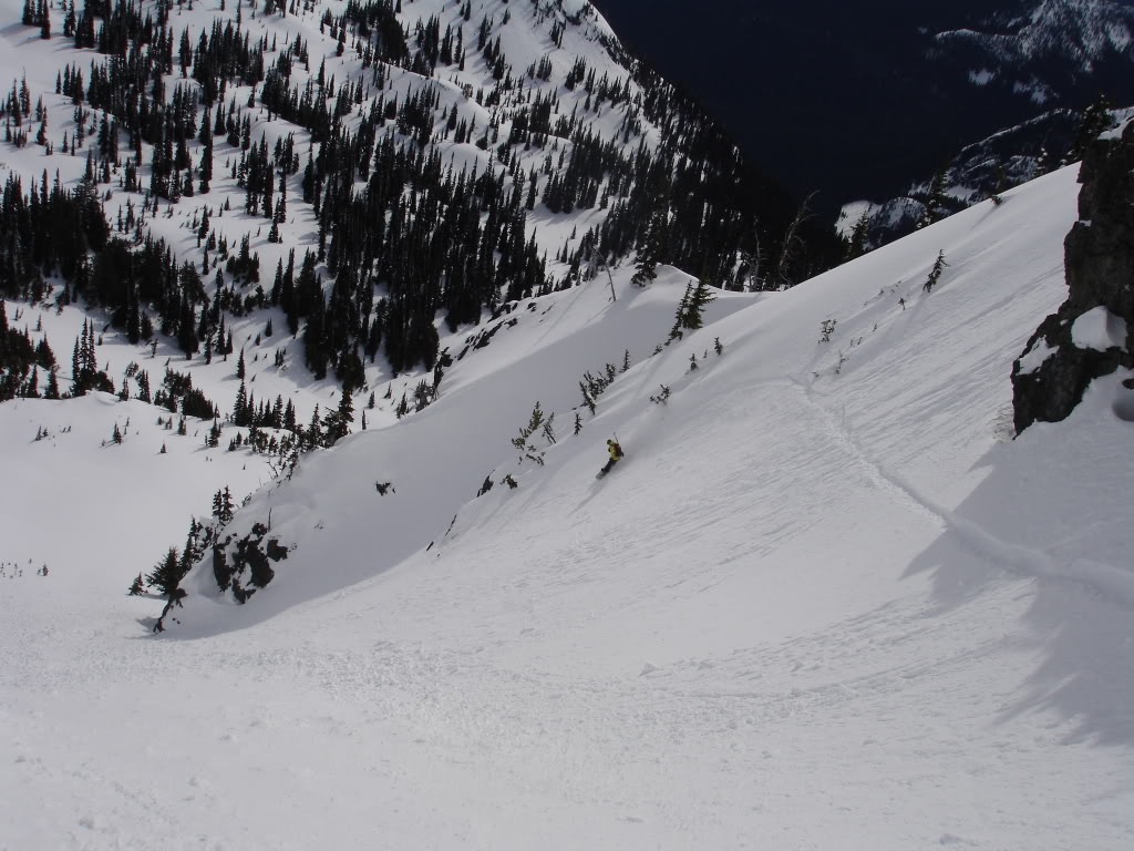 Taking some snowboard turns down the lower portion of the Sheep Lake Chute