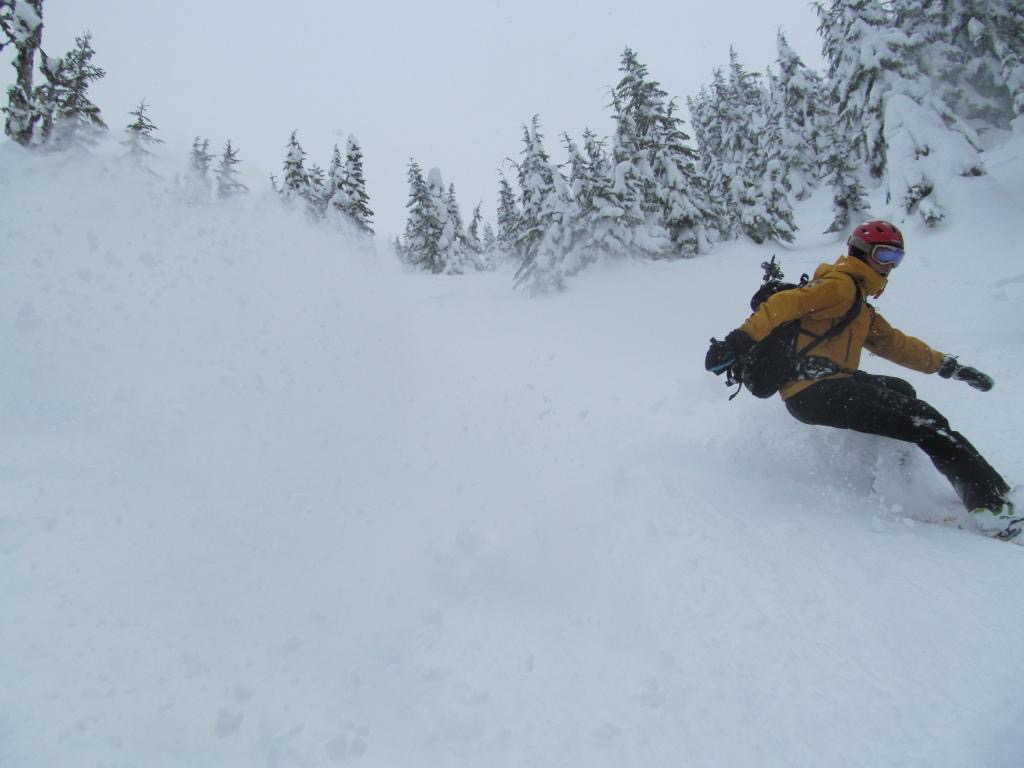 Ben snowboarding down Skyline Ridge