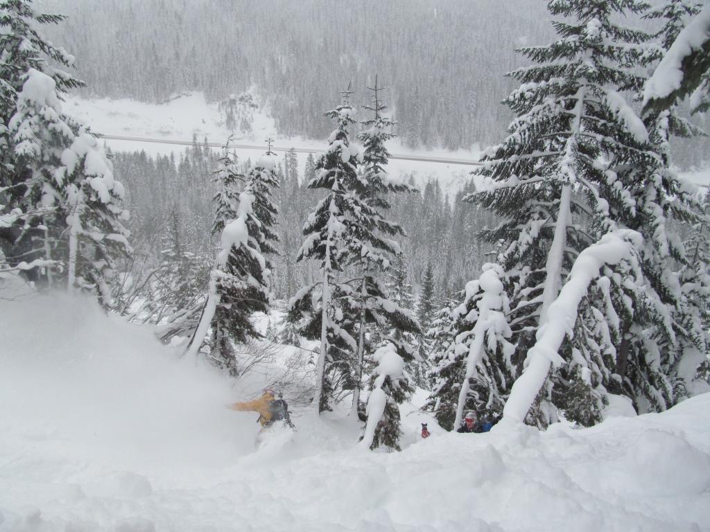 Ben snowboarding down to Scott while Kololo wants to get going