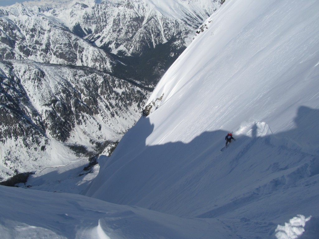 Scott Snowboarding into the Northeast Couloir of Goode Mountain