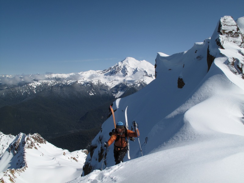 Climbing up the final slope of the North Twin Sister with Mount Baker in the distance