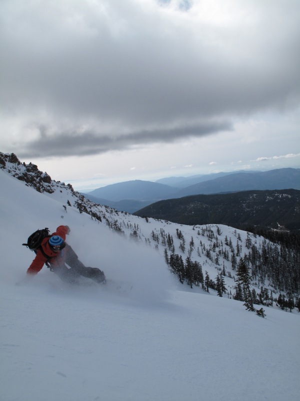 Snowboarding down to tree line on the North Twin Sister