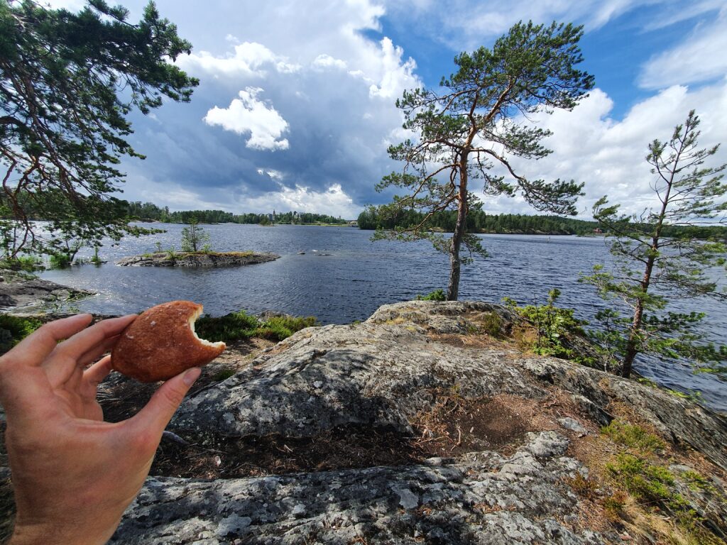 Enjoying a munkki at Savonlinna