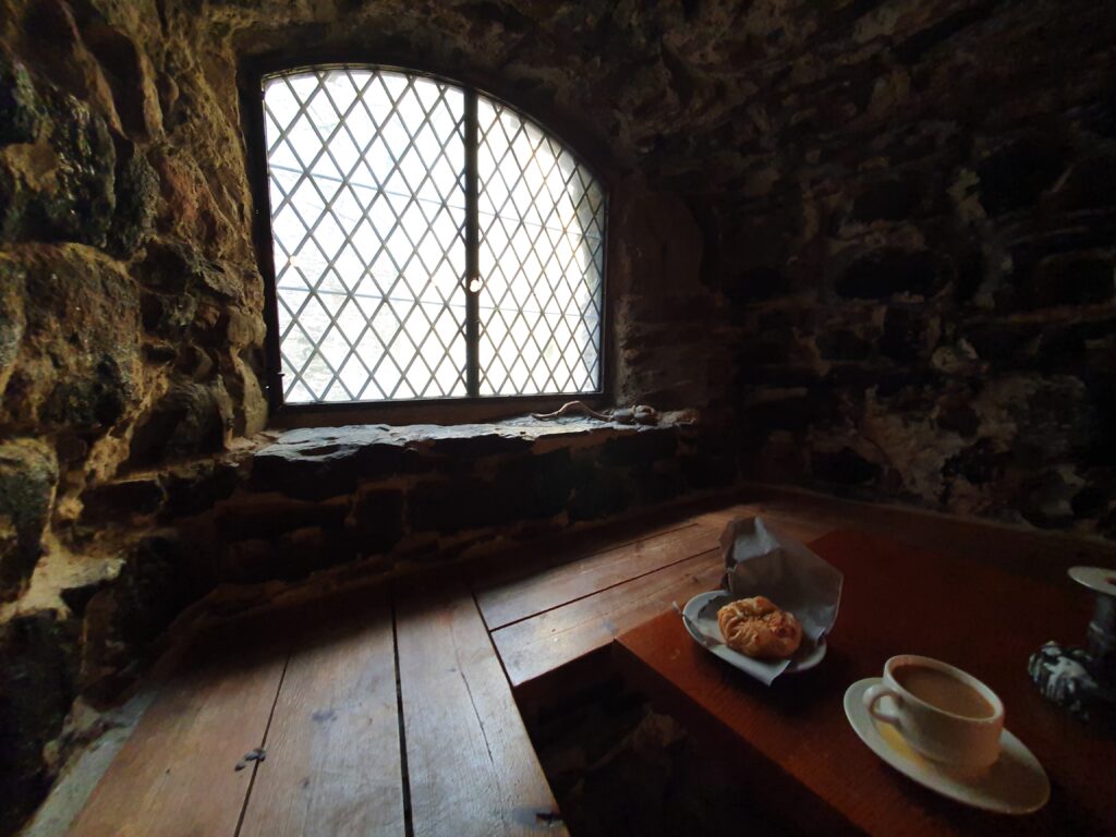 enjoying a coffee inside a castle