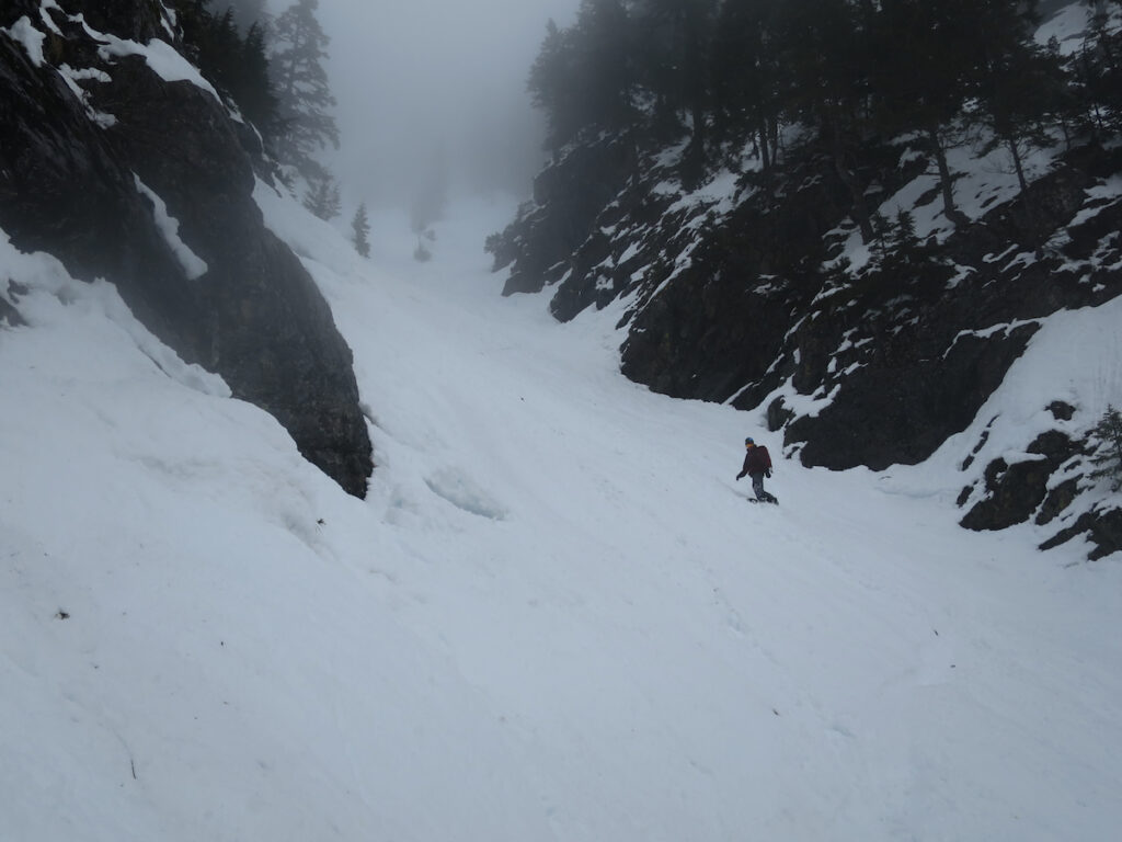 Dropping into a bonus Kendall Peak Chute to the Gold Creek Valley