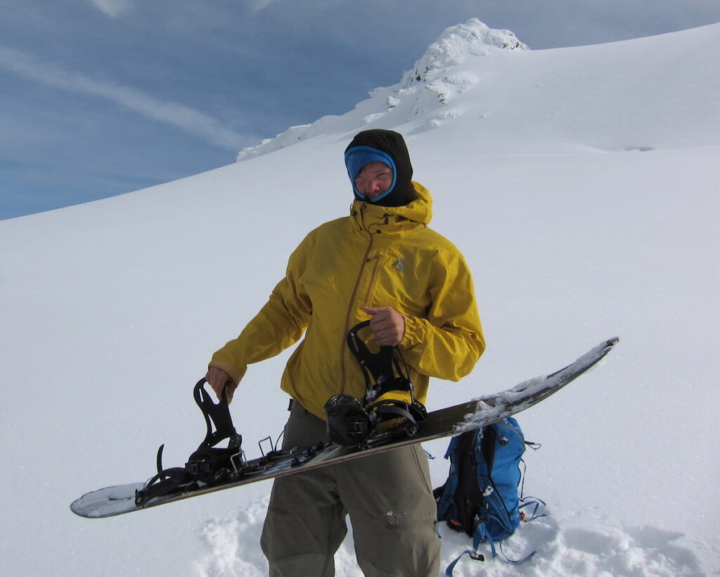 Preparing to snowboard down the Northwest Couloir on Mount Shuksan