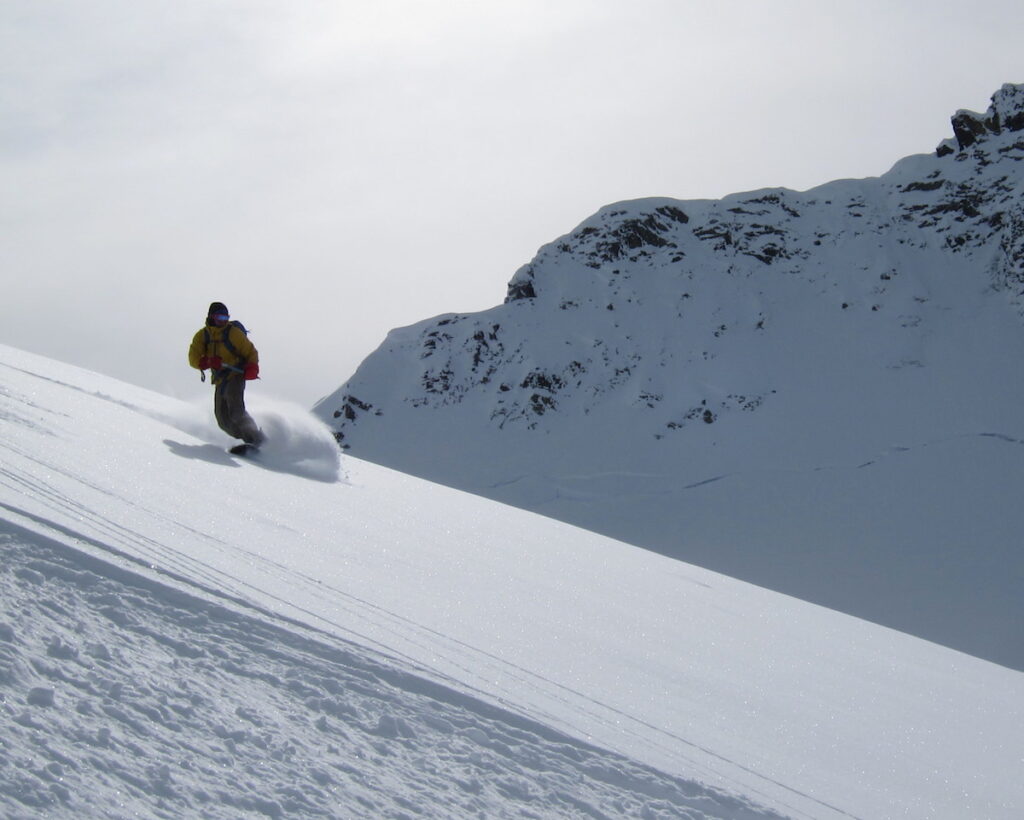 Snowboarding the Hanging Glacier before dropping into the Northwest Couloir