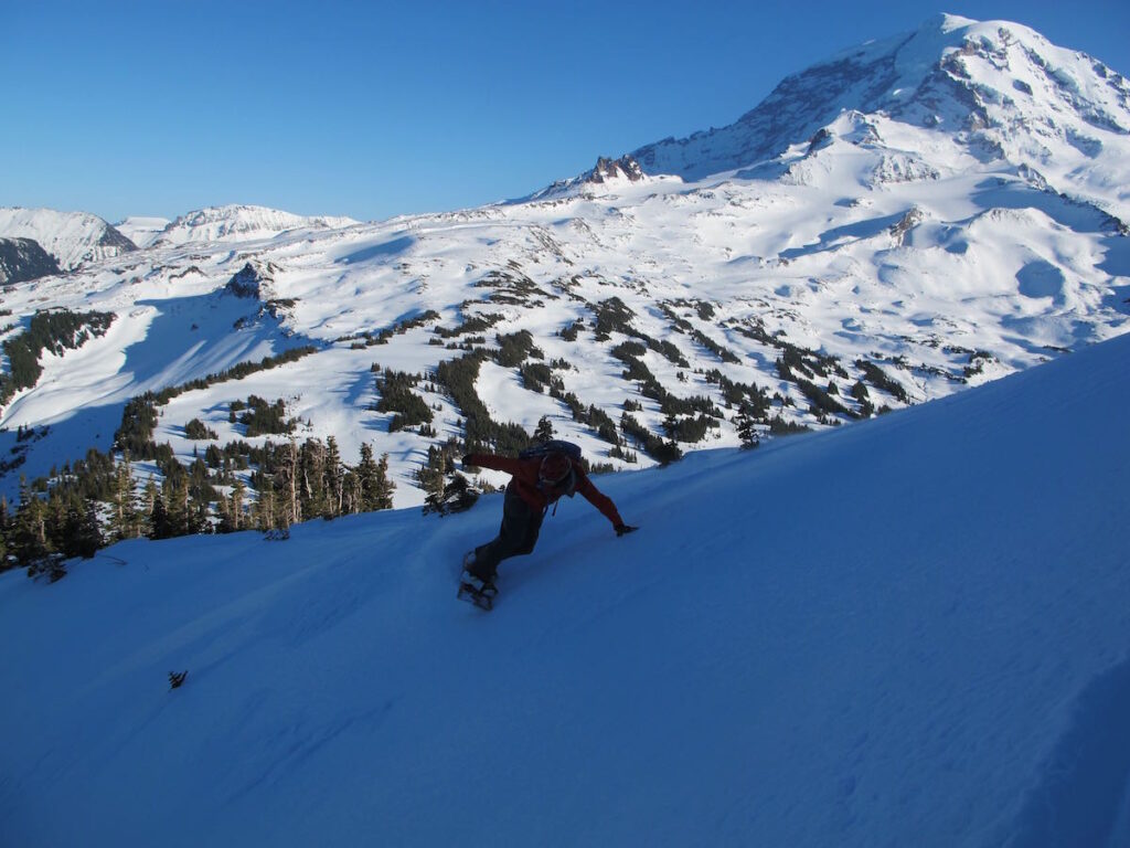 Snowboarding off the summit of Mount Pleasant in Mount Rainier National Park