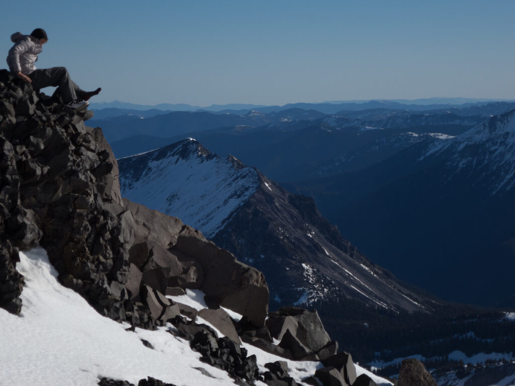 Taking a break on Echo Rock after camping on Mount Pleasant