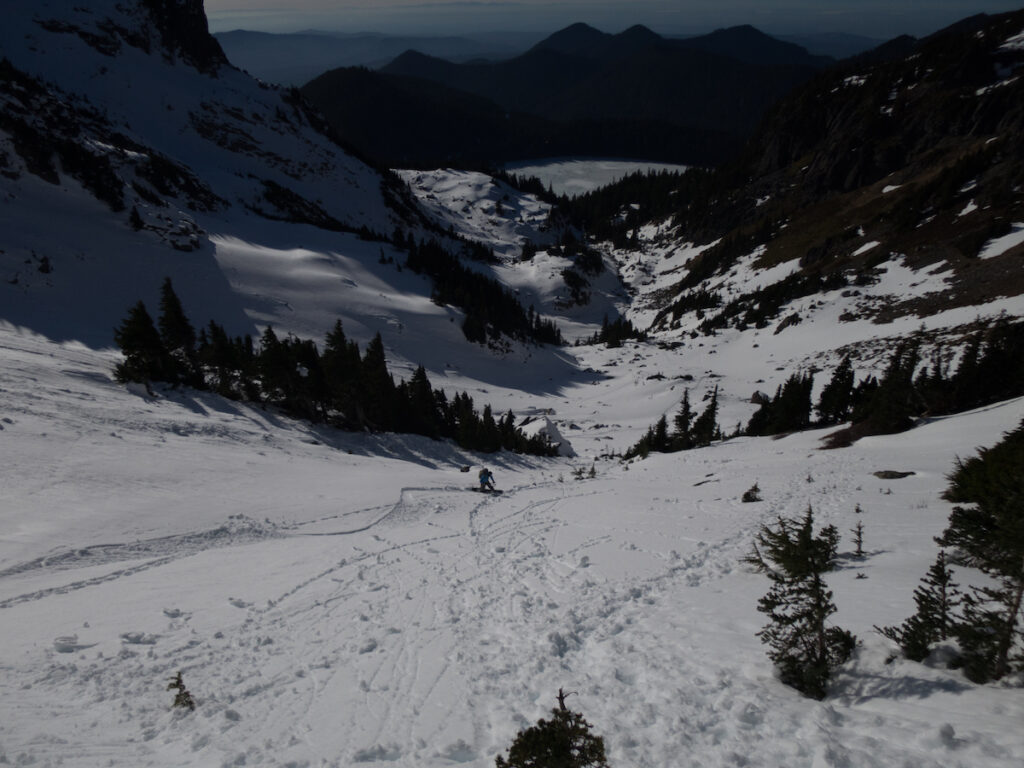 Snowboarding back to Mowich Lake from Mount Pleasant