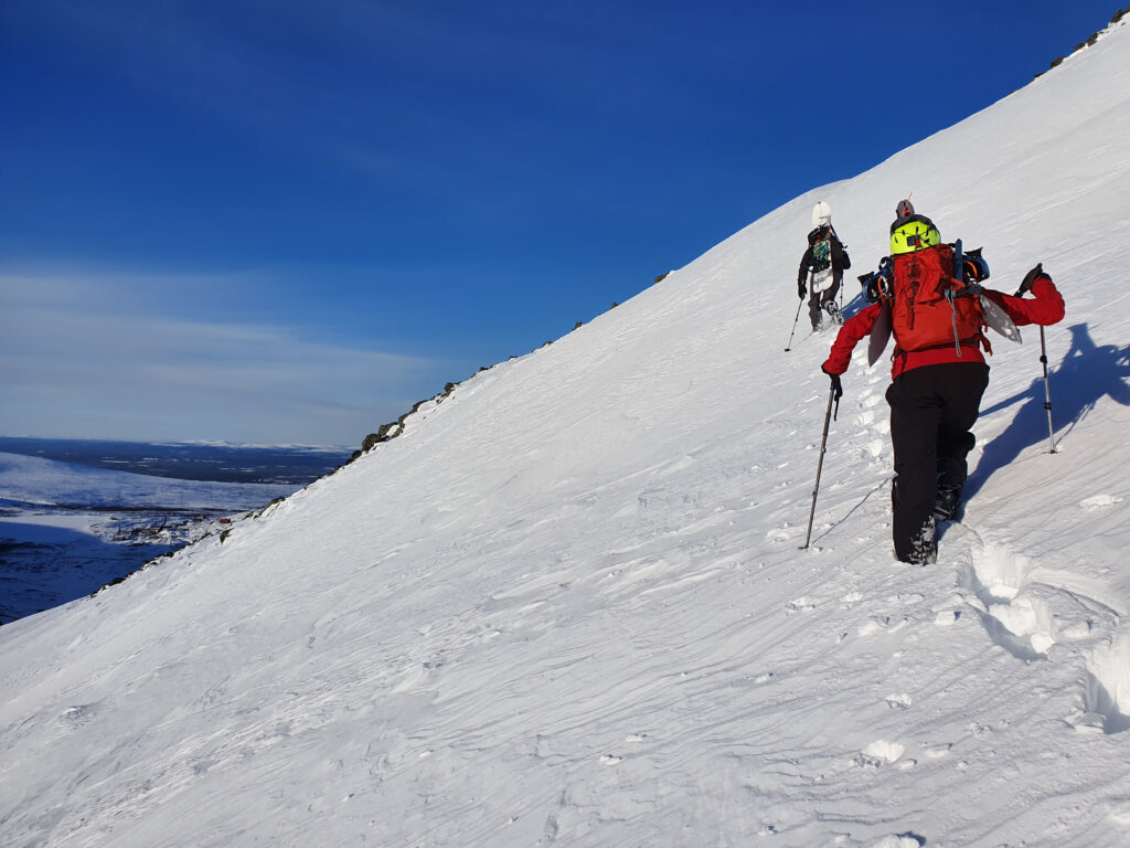 Climbing up our second ski line in Revda