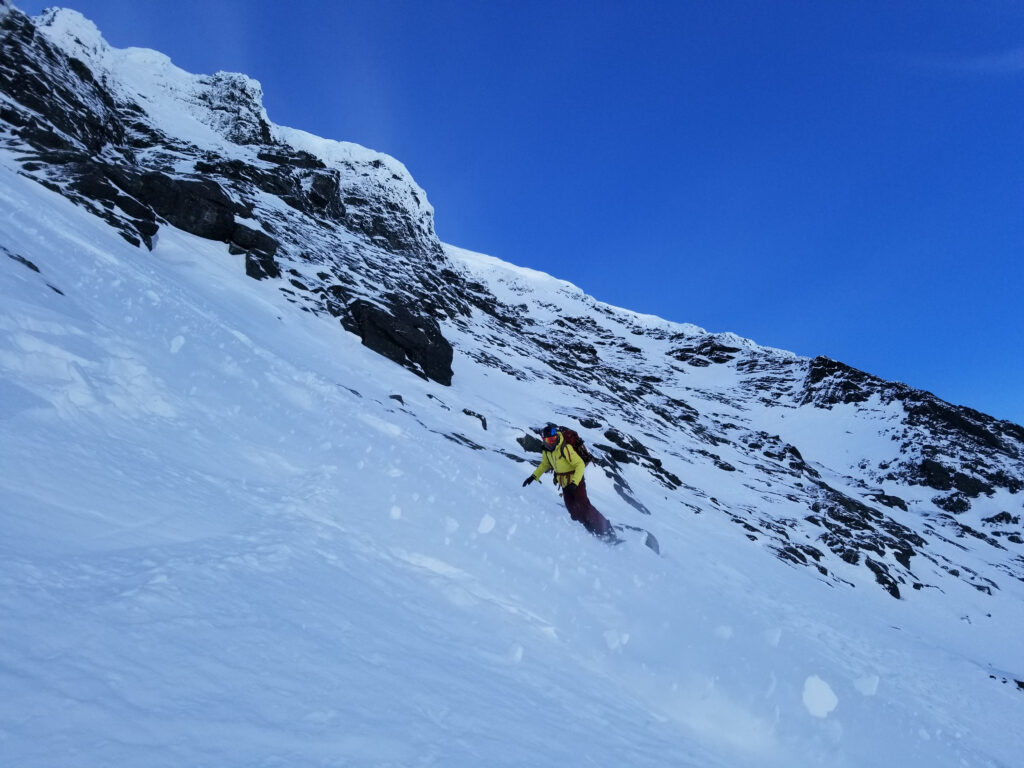 Snowboarding down in unstable conditions