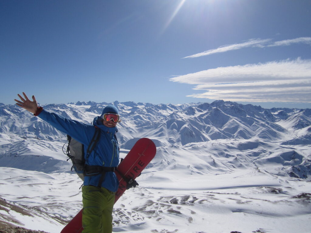 Enjoying a beautiful view of the Andes Mountains at Las Lenas while snowboarding in Argentiina