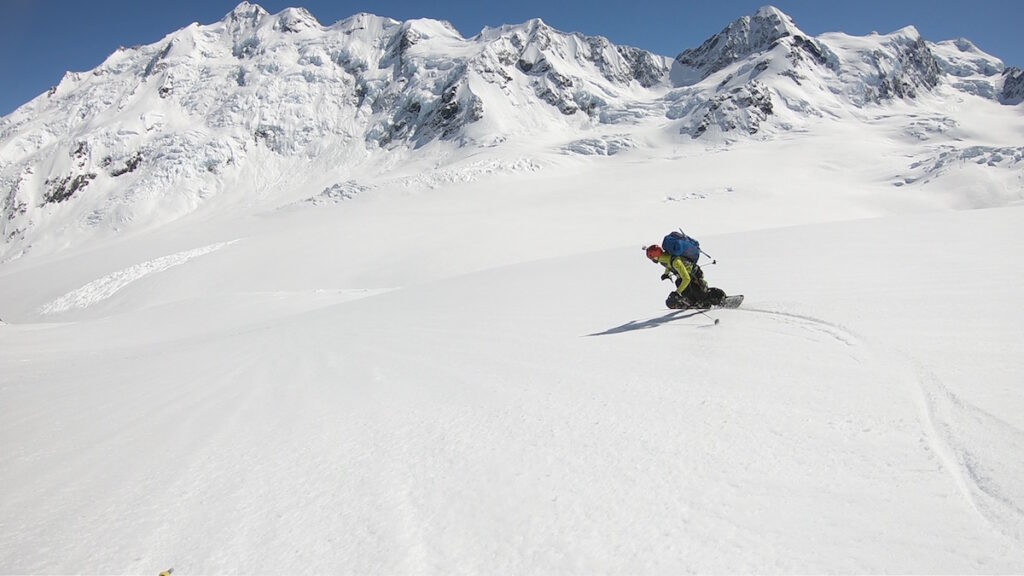 Snowboarding down while enjoying the view of the Tasman Glacier